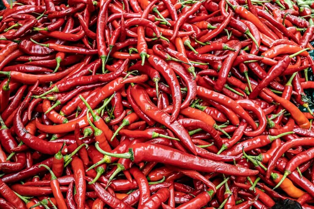 Red Chilli Background. India Ingredient for Sale in Market